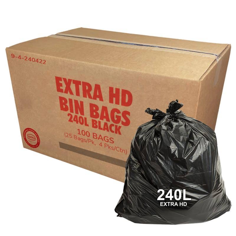 A carboard Box with red writing and a black bin liner at the bottom right corner with a 120L