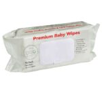 A white background showcasing a pack of beige baby wet wipes with red wording