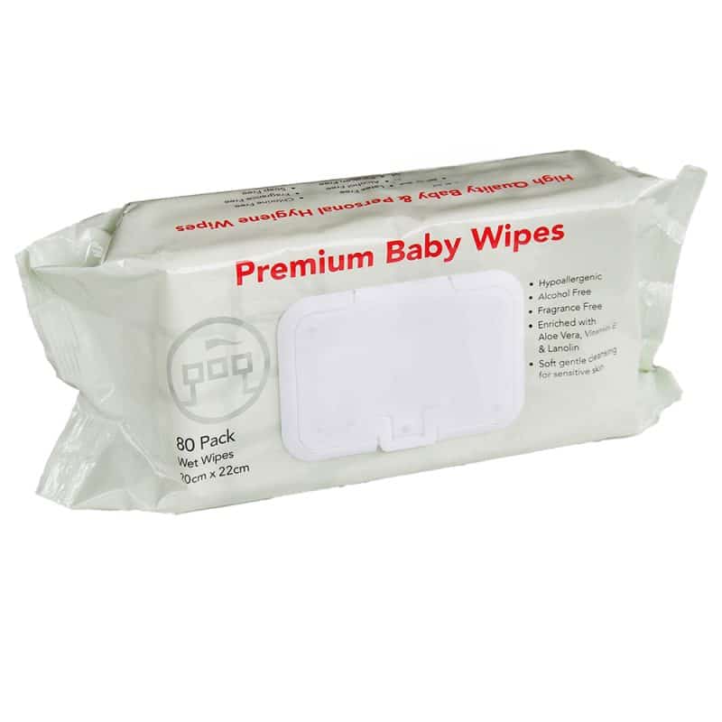 A white background showcasing a pack of beige baby wipes with red wording