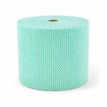 Jumbo wipes roll green roll stacked on a plain background
