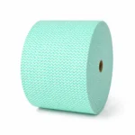 Jumbo wipes roll green roll stacked on it's side on a plain background