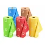 Five different color rolls of Bamboo wipes stacked next to each other with a white background.