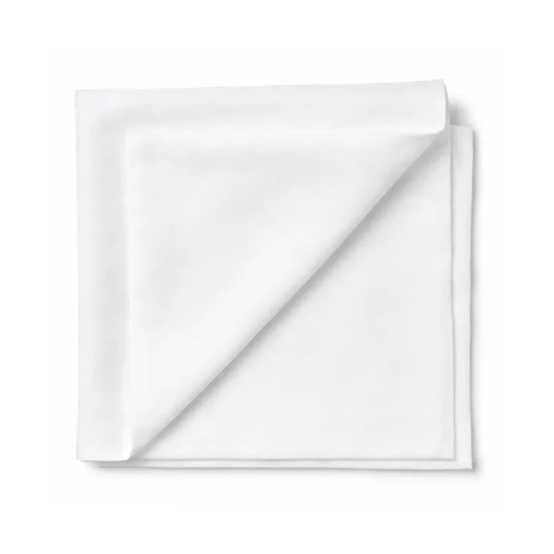 Top view of white LintNIL low lint patient wipes stacked with the top wipe folded over to the left