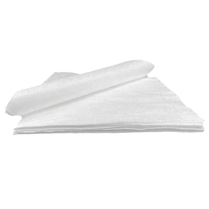 Compact pile of wipes with the uppermost wipe folded upward, set against a white background.