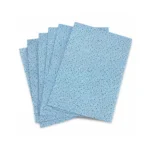 Textured blue oil absorbing wipes with a pattern fanned out on a plain background