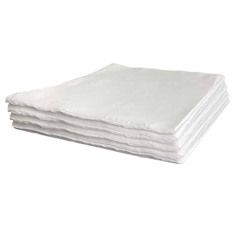 A neat pile of white wipes on a plain white background