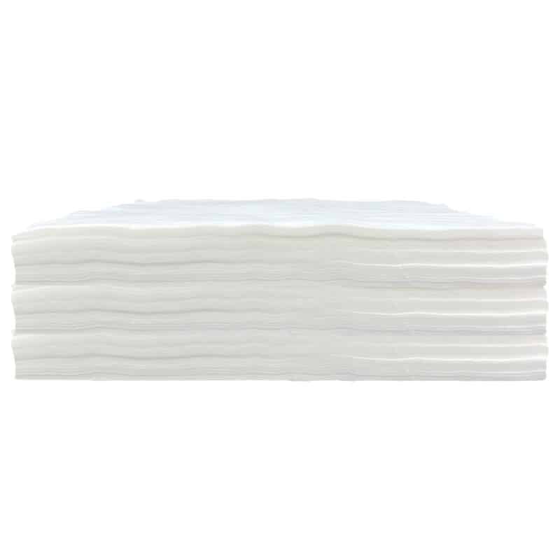 A side view of a stack of polyester wipes with a white background