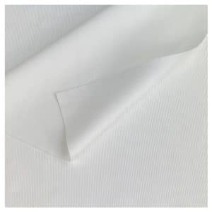 A close up of TIDDOX white polyester wipes with the top left corner curved over itself