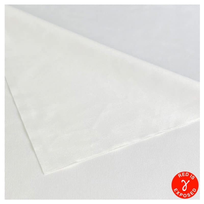 Close up view of a Sterile Polyester Wipe with the top layer curved downward