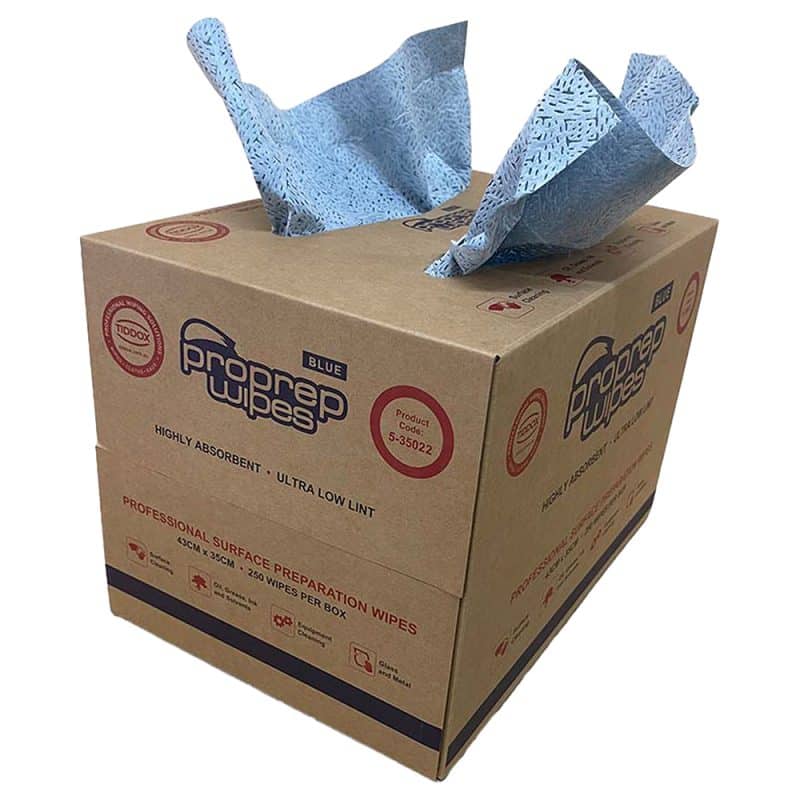 Brown carry-sized dispenser box with blue and red writing with two wipes sticking out the top