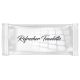 A white and off grey refresher wipes with black writing on a white background, reflecting light.