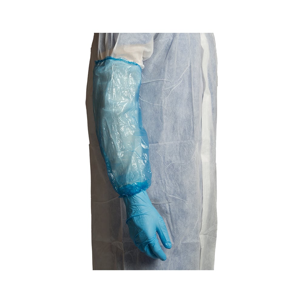 Side view of a person wearing a green glove and a white coat with a disposable blue sleeve protector