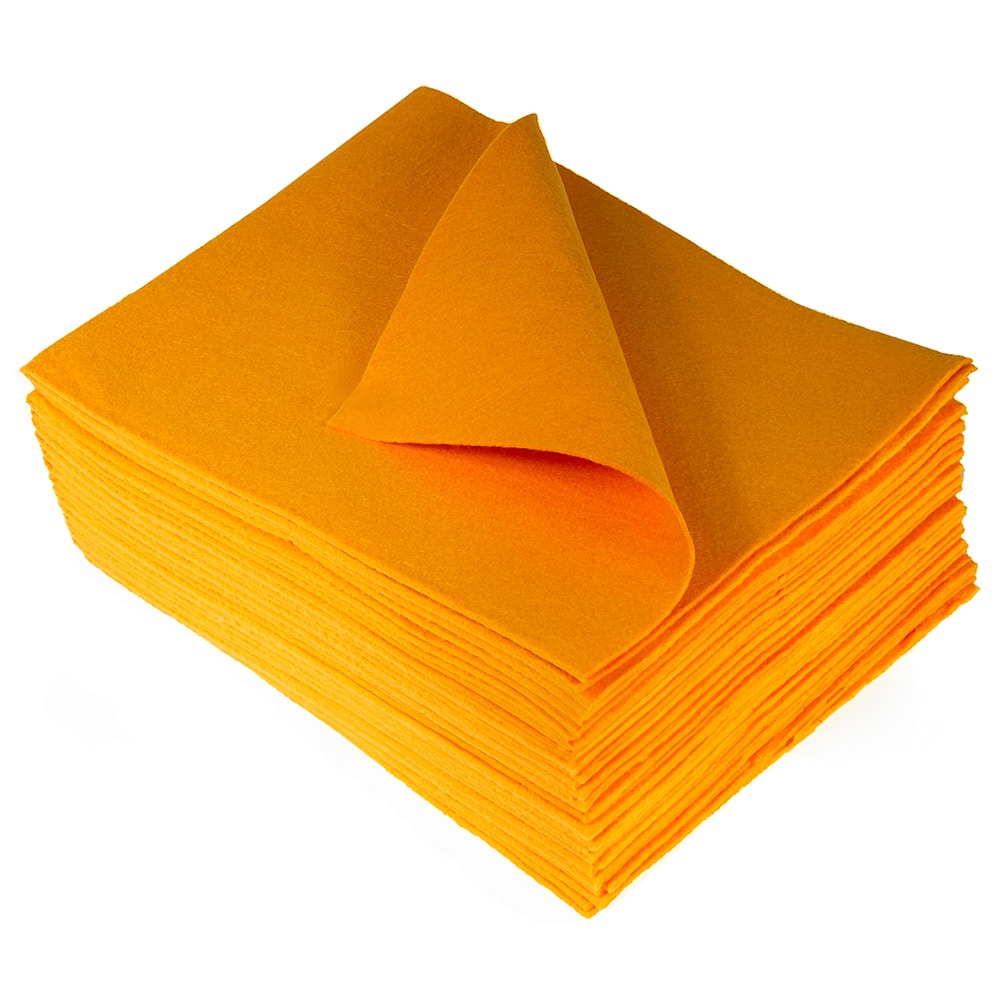 Overhead perspective of a stack of vibrant orange cloths with the uppermost cloth gracefully curved to the left against a plain background.