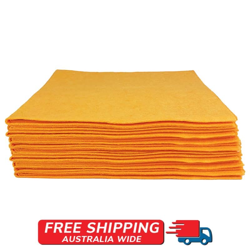 Side perspective of a pile of lively orange cloths set against a simple background.