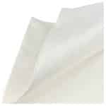 Close-up of a stack of white wipes, focusing on the top wipe with a curved appearance.