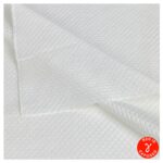 Close-up of the quilted pattern on TIDDOX sterile polyester lint free cleanroom wipes, featuring a folded top right corner