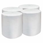 Group of four vertical white polypropylene cellulose rolls on a simple background