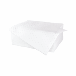 stack of white absorbent pads with one sheet hanging from pile