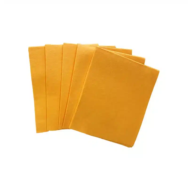 five orange absorbent pads on a white background